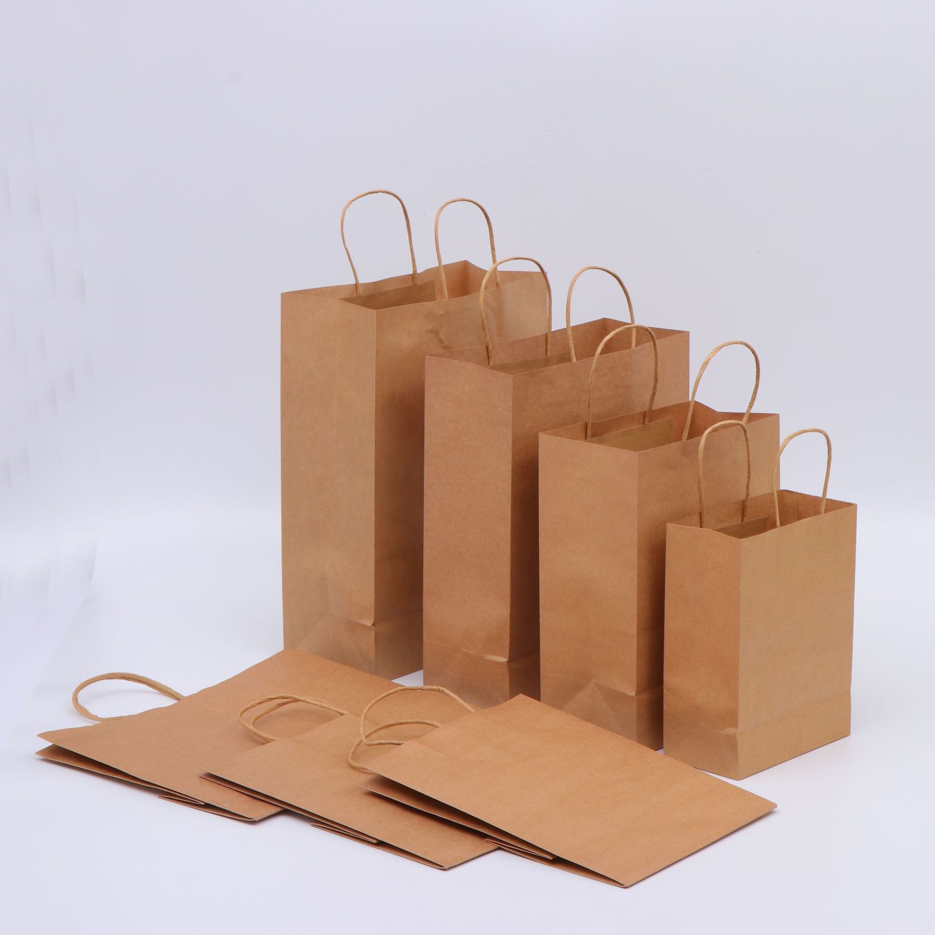 China Wholesale Eco-friendly Recyclable Kraft Paper Packaging Gift Bags,Twisted Handle Bags